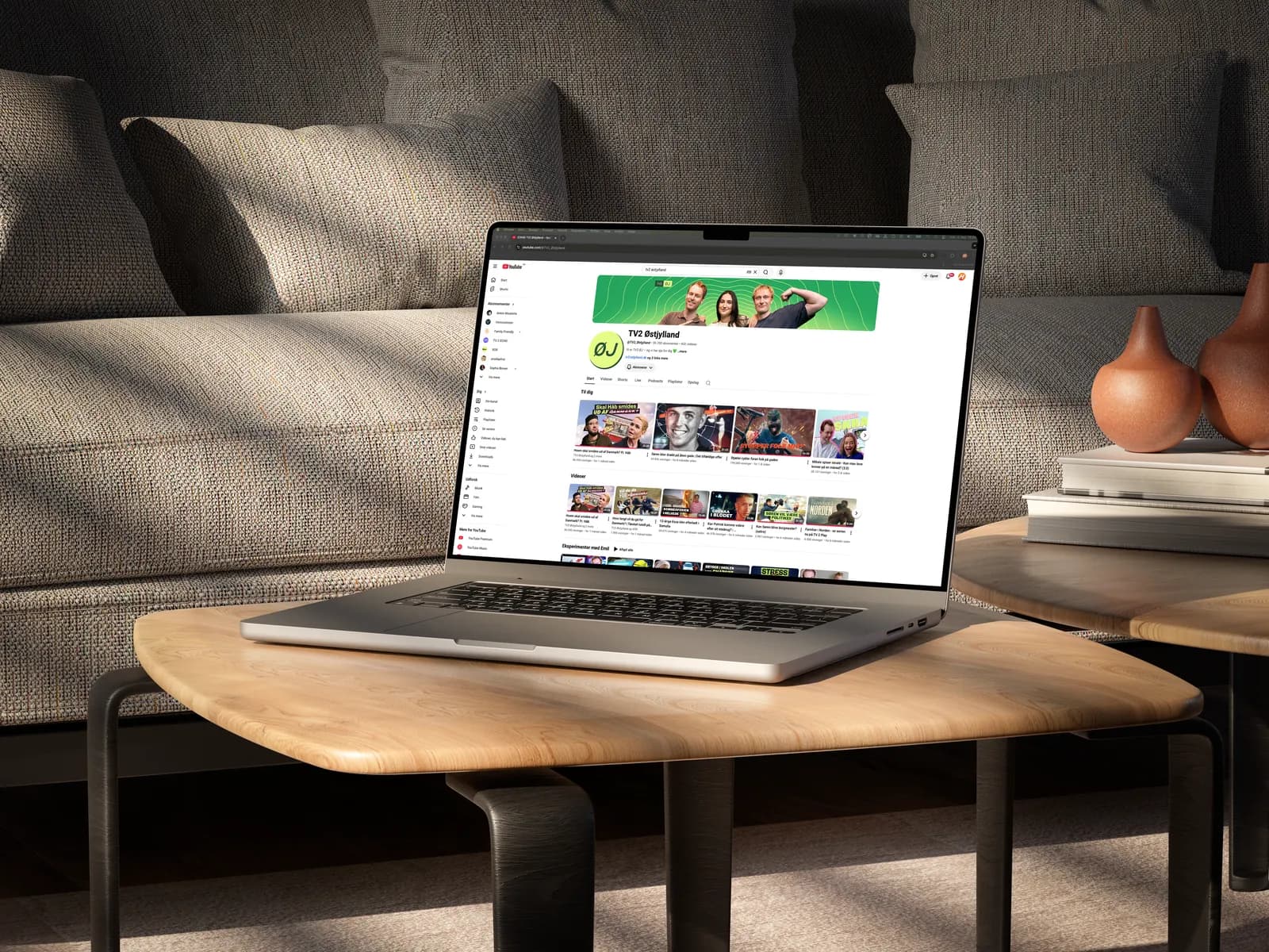 The YouTube channel displayed on a MacBook